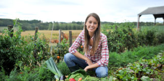 Woman knelt in vegetable garden