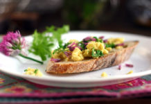 Scrambled eggs with chicory and chive blossoms