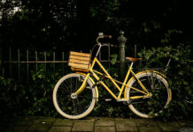 bike resting on fence