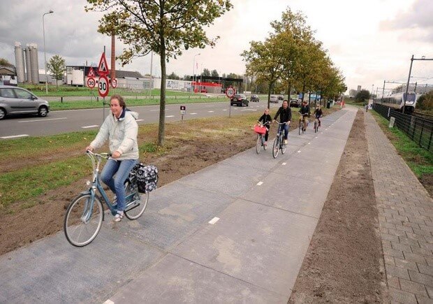 Netherlands cyclists riding on solar powered bike path