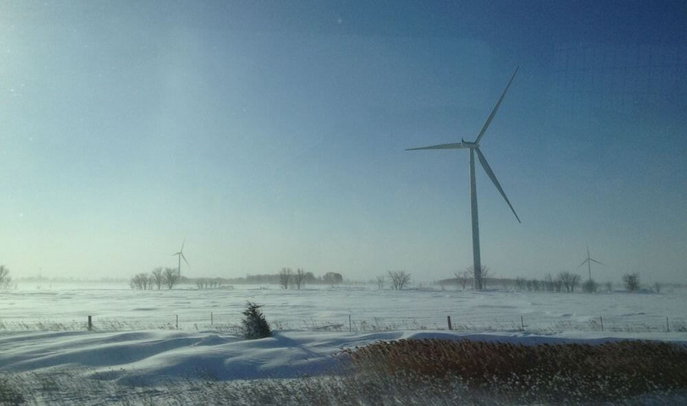 snowy wind turbines in Canada