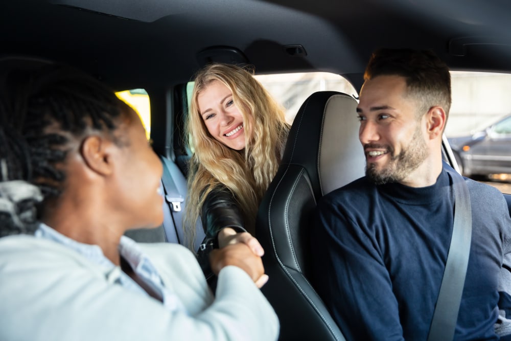  People carpooling together to reduce carbon emissions and save money.