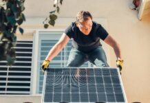 man installing solar panels