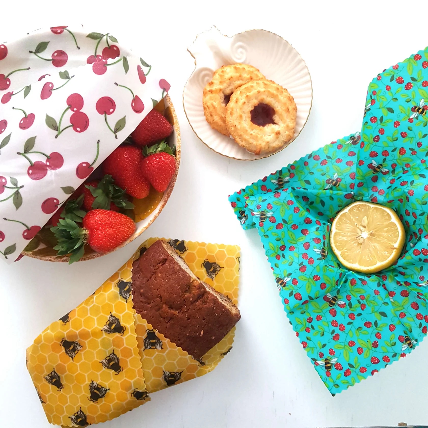 beeswax wraps holding different types of food