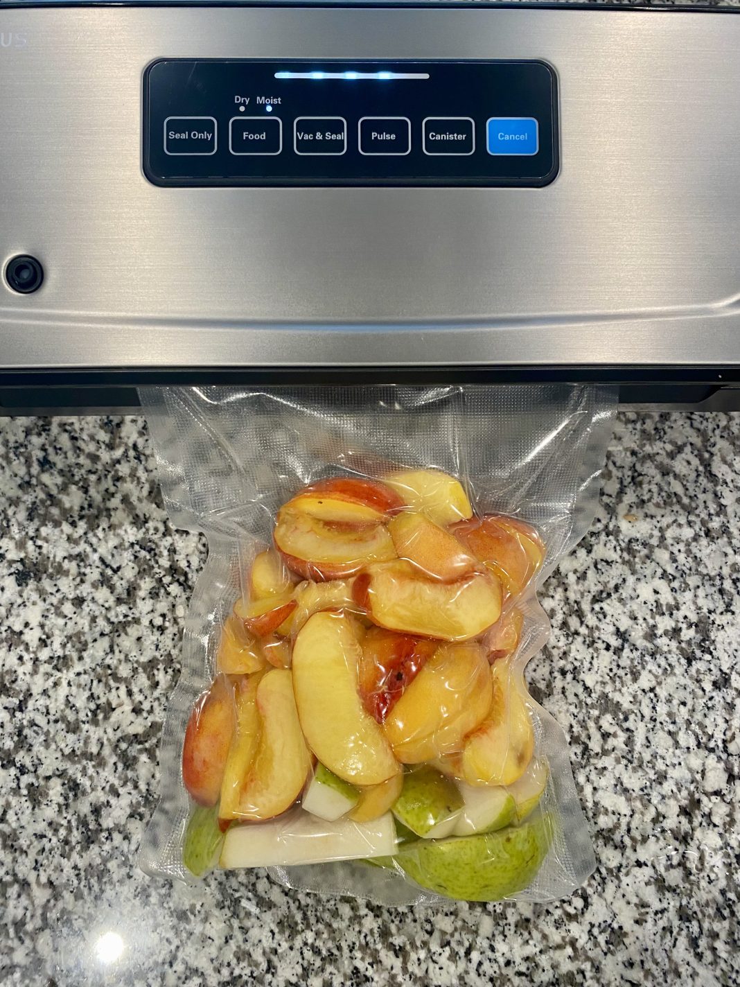 INKBIRD plus vacuum sealer and a sealed bag of fresh produce from the farmer's market