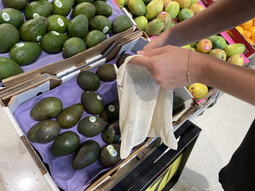 putting avocados in a mesh produce bag