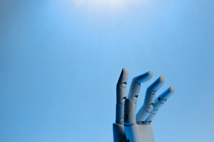 robot fingers on blue background