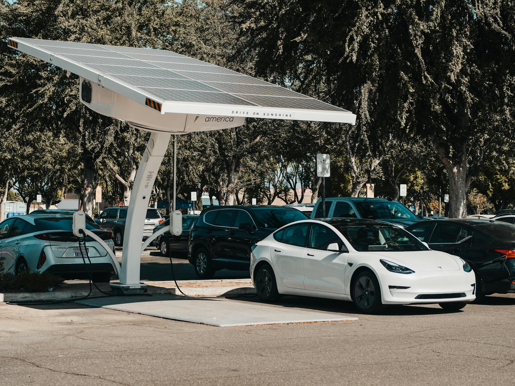 Electric vehicles charging at a station