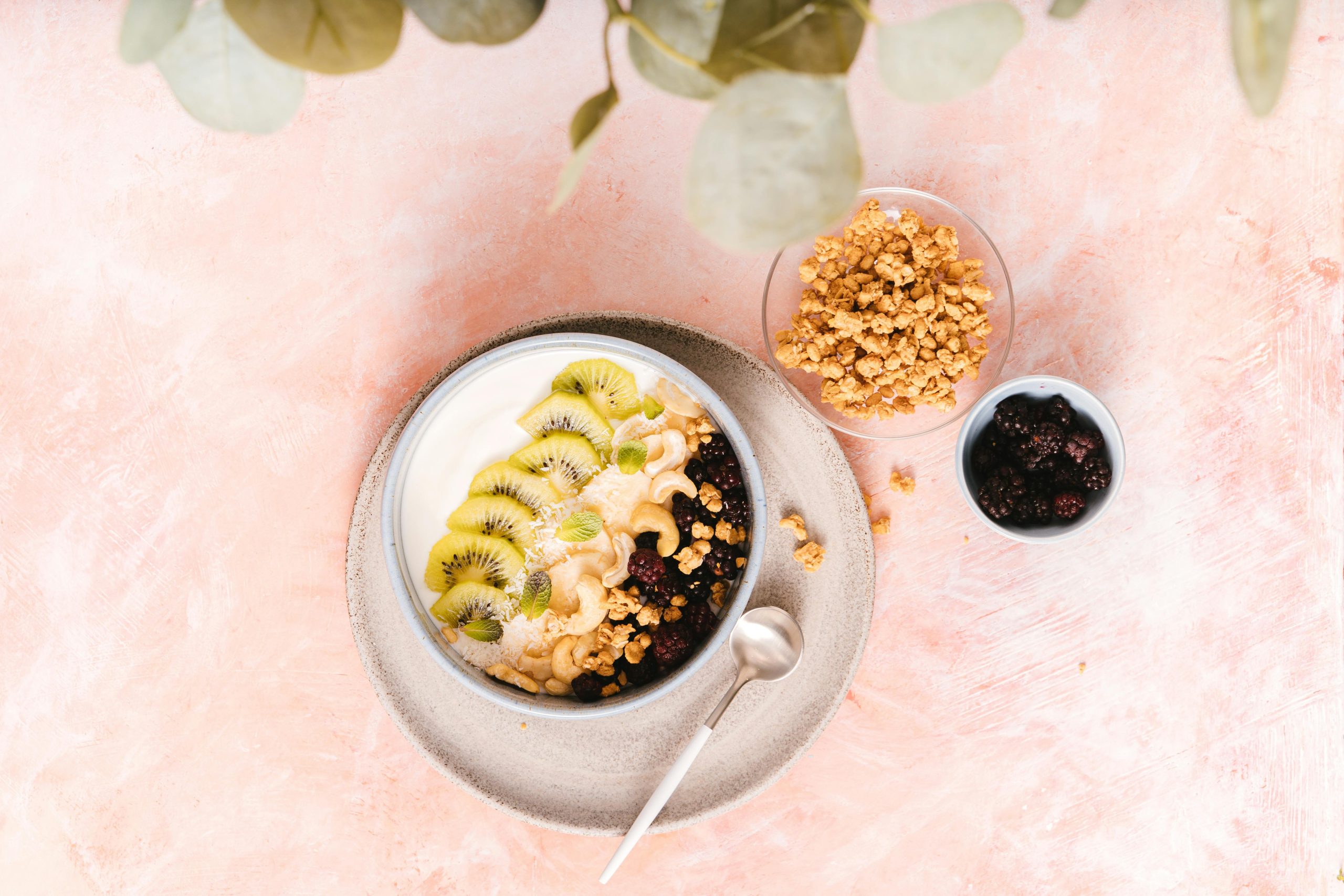 bowls of yogurt, nuts and berries and granola