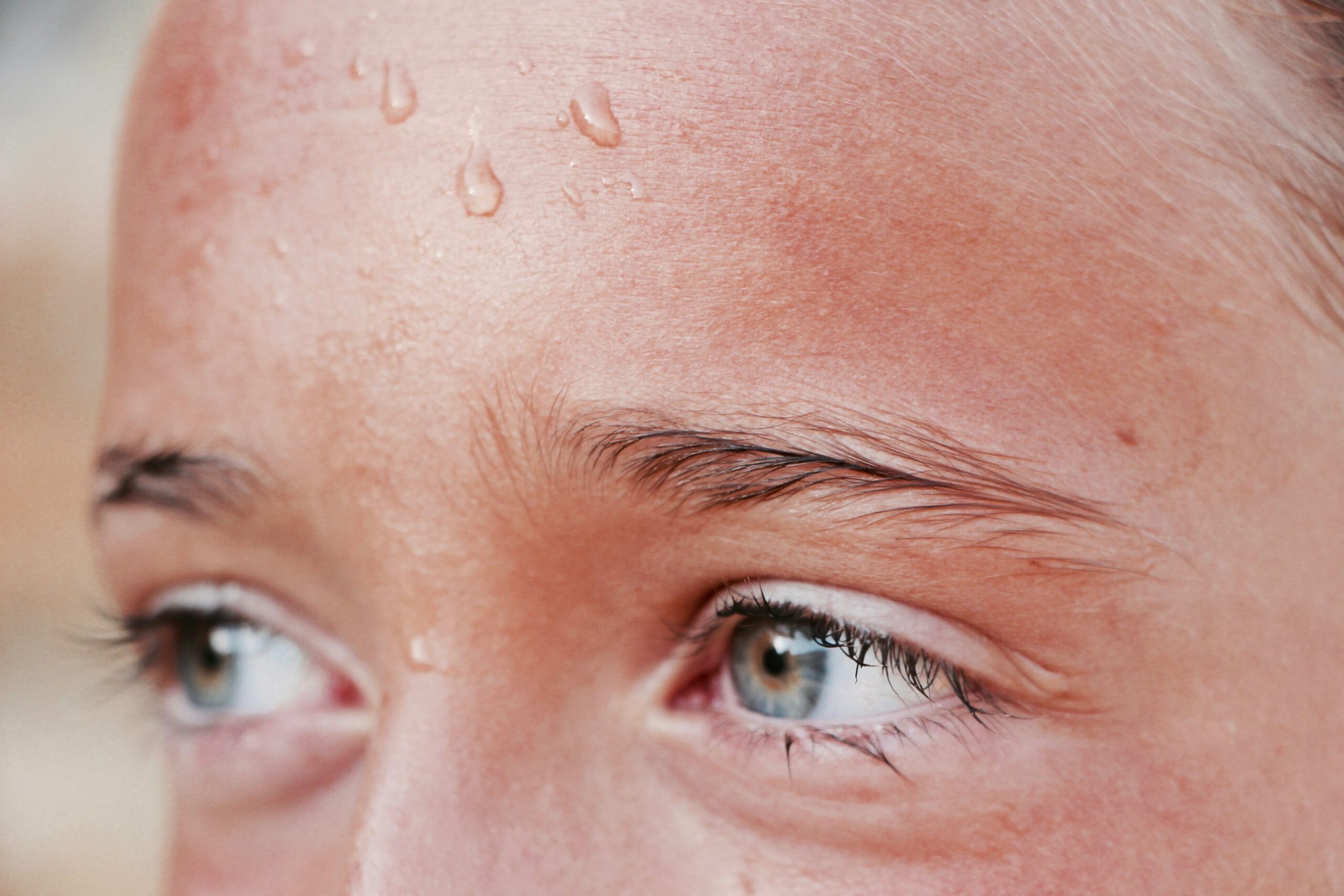 woman with sweat on her forehead